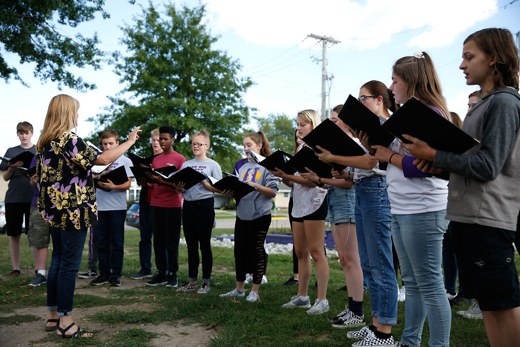 Robin Steinhaus, the choir director at Hickman High School, leads the choir as they sing 'Seasons of Love'